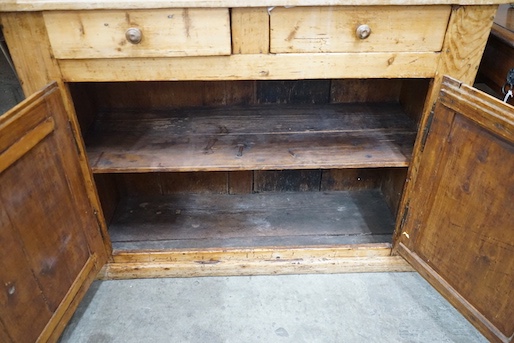 An 18th century and later French provincial pine dresser, width 114cm, depth 44cm, height 195cm